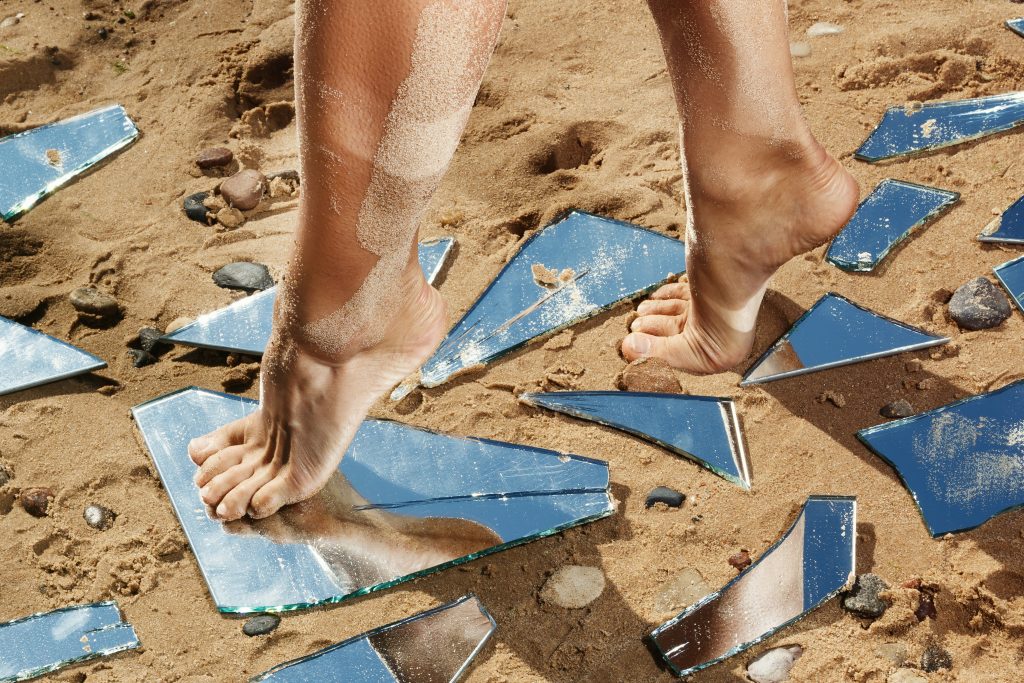 Glass In Foot Infection Symptoms In Naperville female legs mirror shards sand