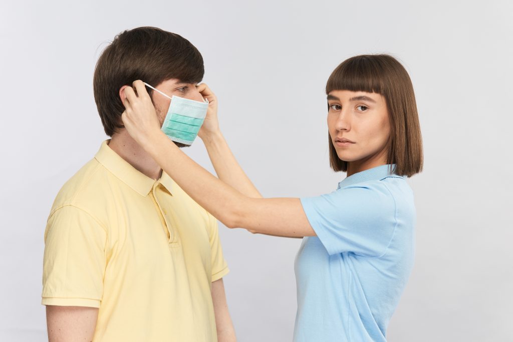 Why Is My Body Prone To Fungal Infections? 1 young girl blue shirt putting man face protective mask